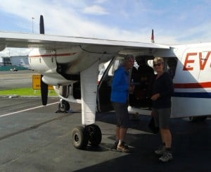 Climbing into our little plane.