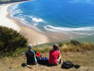 Watching the surfers at Whangapoua.