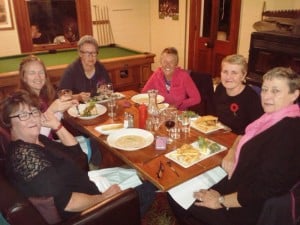 Cosy fireside meal at Furneaux Lodge.