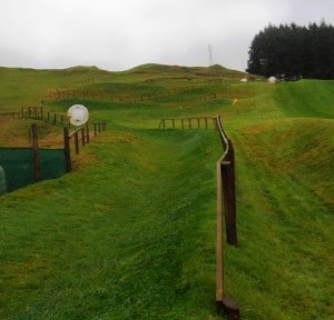 Rolling down the hill. That's us, the little black dots inside the ball.